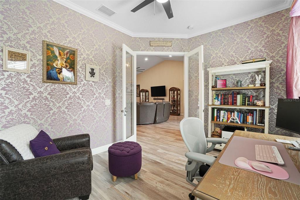 3230 Pheasant Trail Mims, FL 32754 - Photo 40 of 71 a living room with furniture and a book shelf