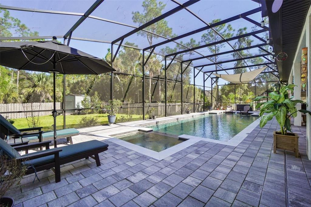 3230 Pheasant Trail Mims, FL 32754 - Photo 44 of 71 a view of swimming pool with a lounge chairs