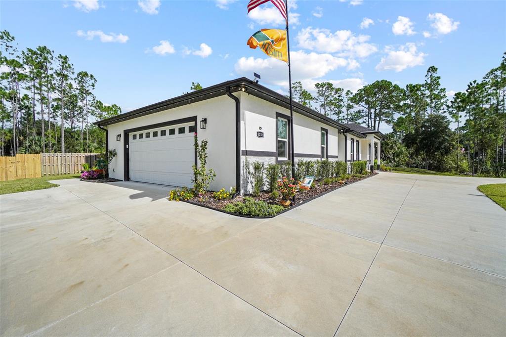 3230 Pheasant Trail Mims, FL 32754 - Photo 5 of 71 a front view of a house with yard and garage