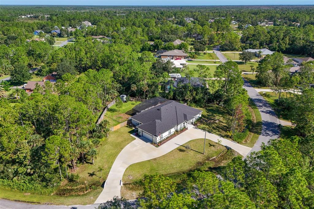 3230 Pheasant Trail Mims, FL 32754 - Photo 57 of 71 an aerial view of residential house with outdoor space and trees all around