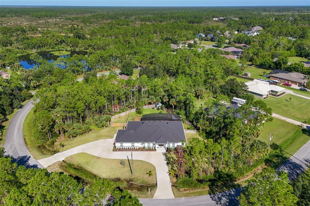 3230 Pheasant Trail Mims, FL 32754 - Photo 60 of 71 an aerial view of residential houses with outdoor space and trees all around