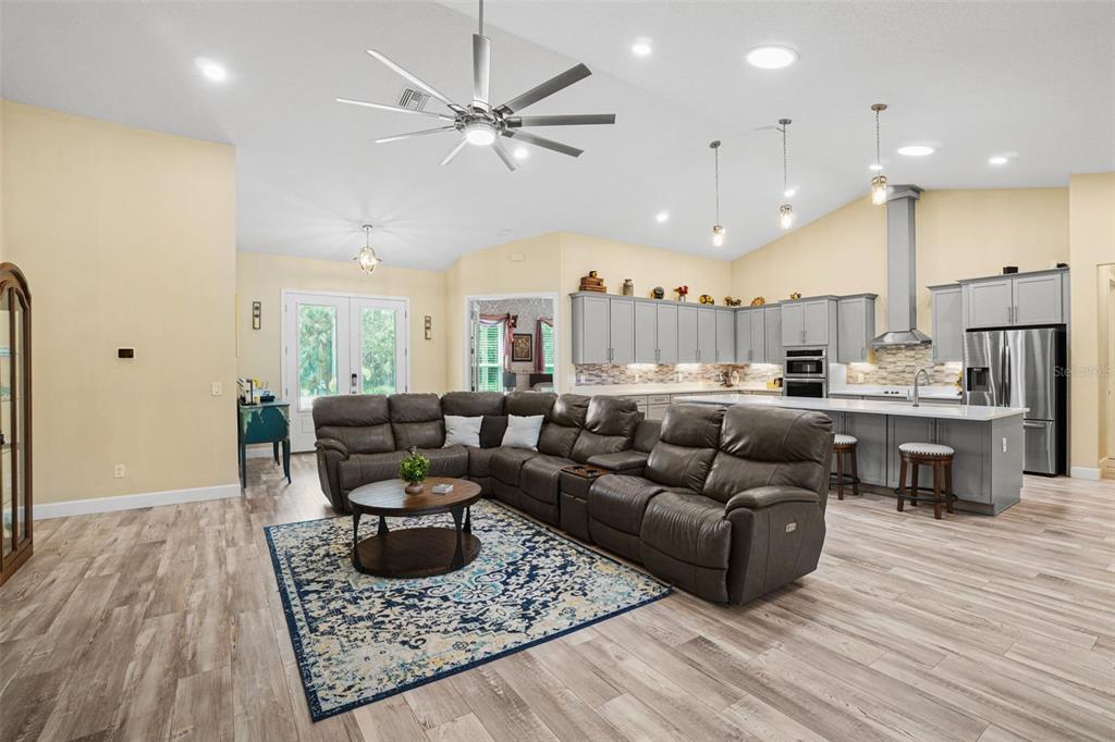 3230 Pheasant Trail Mims, FL 32754 - Photo 9 of 71 a living room with lots of furniture and a wooden floor