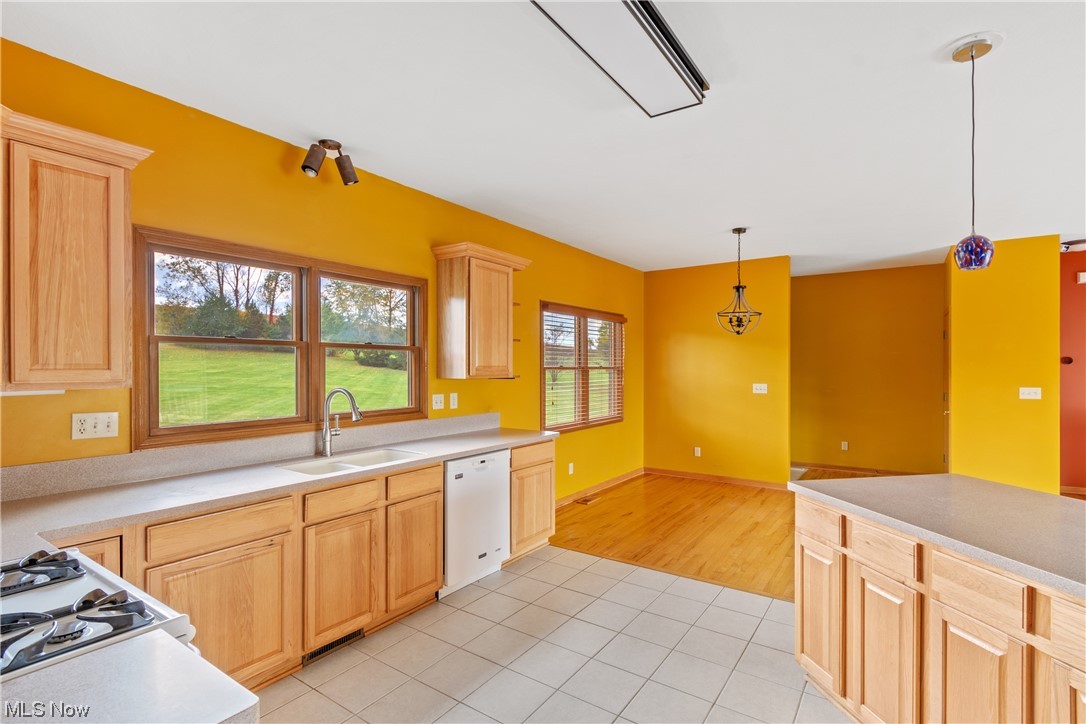 5670 South Funk Road Shreve, OH 44676 - Photo 14 of 35 Kitchen featuring Corian countertops and pendant lighting