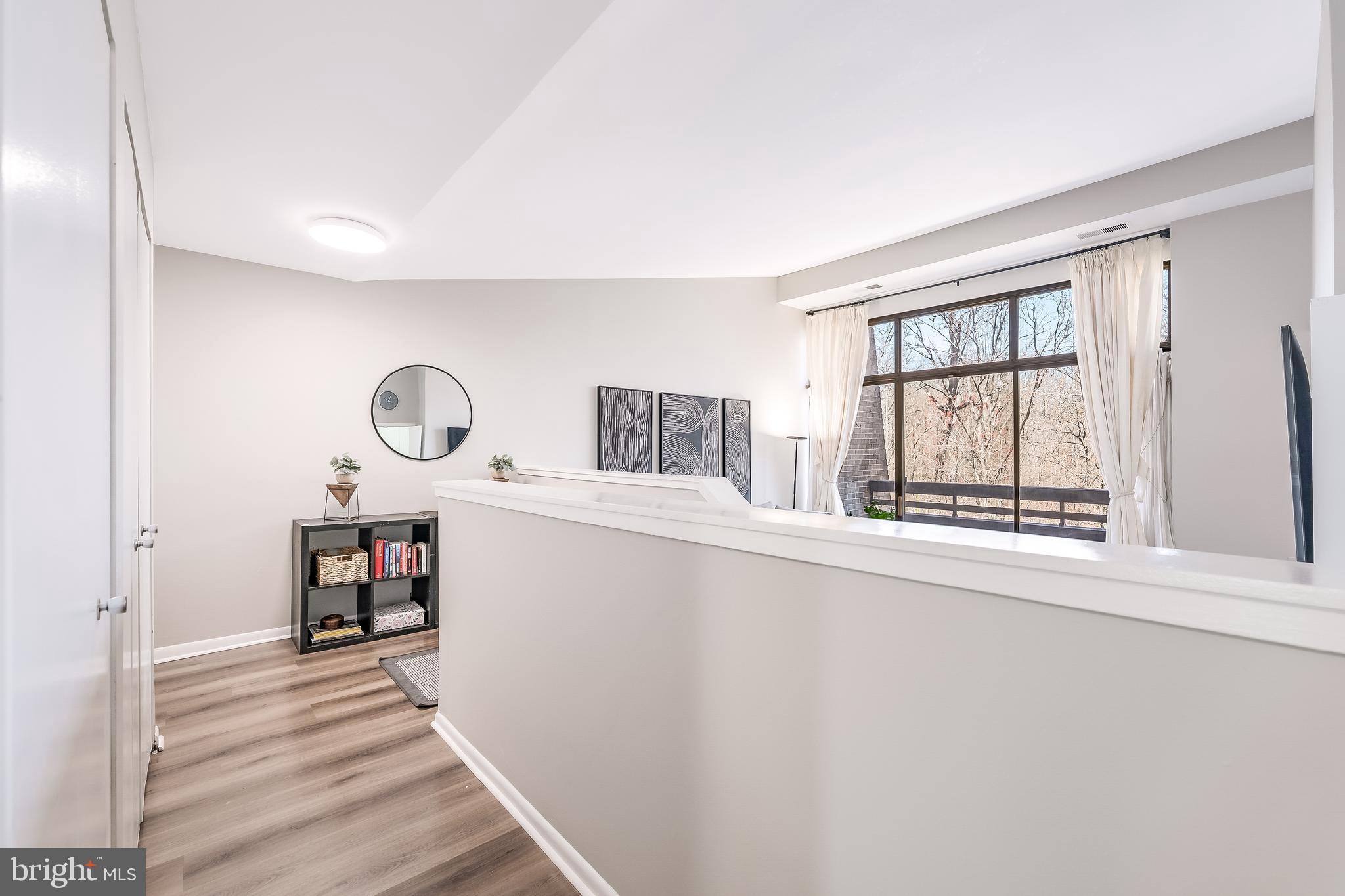 11564 Rolling Green Court, Unit 12/301B Reston, VA 20191 - Photo 16 of 31 a view of a living room and a window