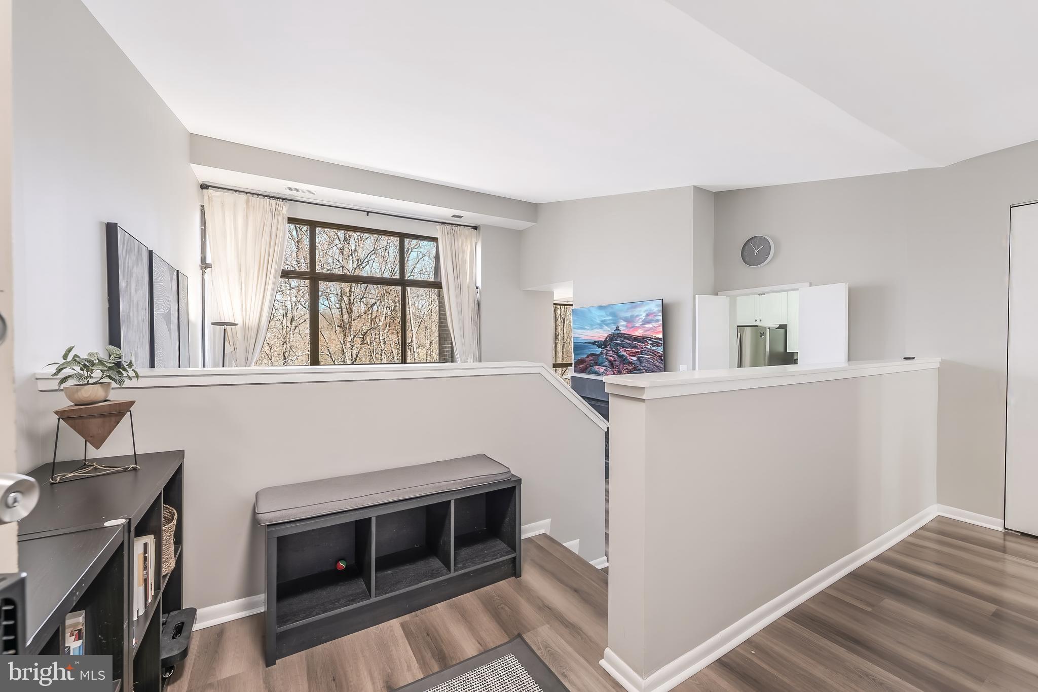 11564 Rolling Green Court, Unit 12/301B Reston, VA 20191 - Photo 17 of 31 a kitchen with stainless steel appliances a stove and a refrigerator