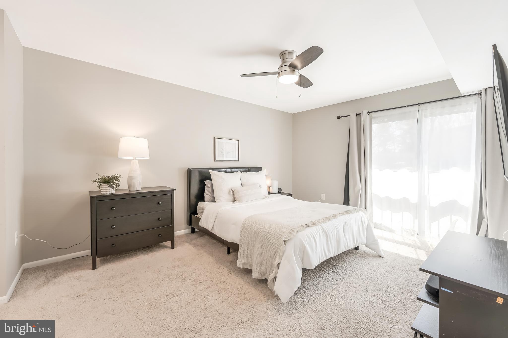11564 Rolling Green Court, Unit 12/301B Reston, VA 20191 - Photo 19 of 31 a bedroom with a bed and a window