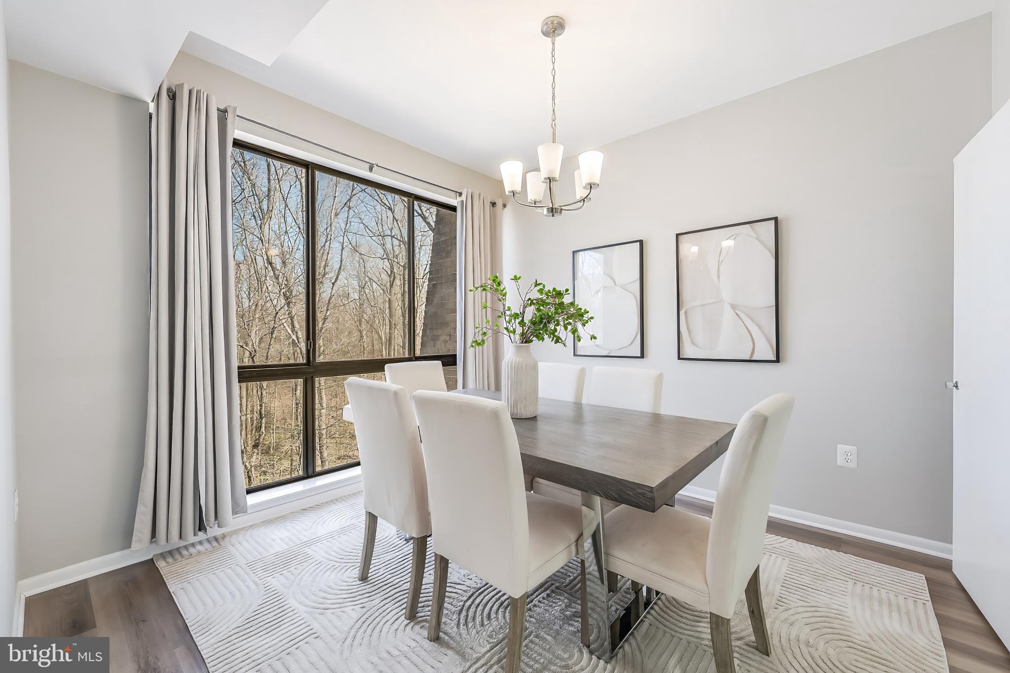 11564 Rolling Green Court, Unit 12/301B Reston, VA 20191 - Photo 9 of 31 a view of a dining room with furniture window and outside view