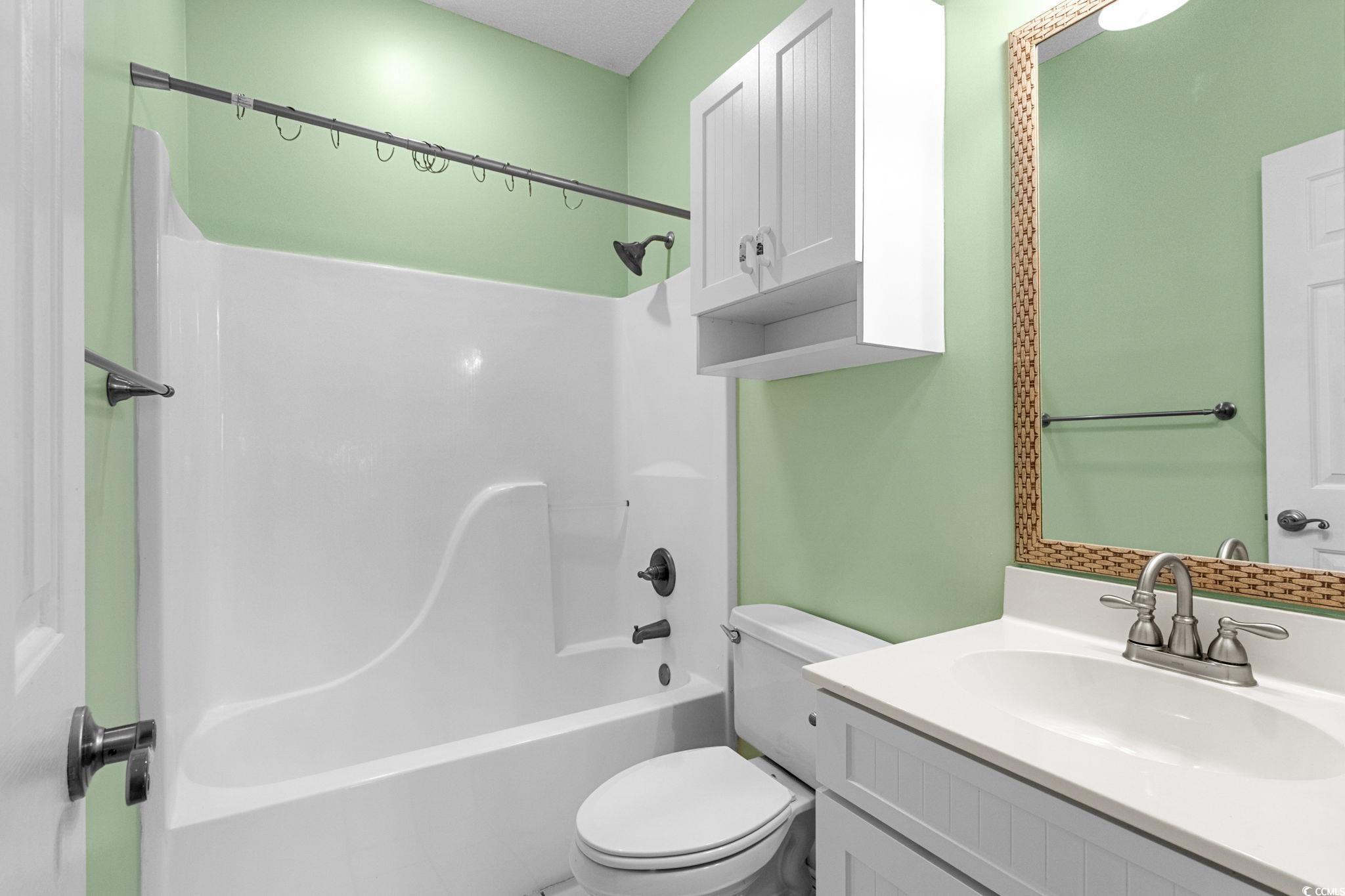 4815 Orchid Way, Unit 302 Myrtle Beach, SC 29577 - Photo 12 of 26 Full bathroom featuring vanity and bathtub / shower combination