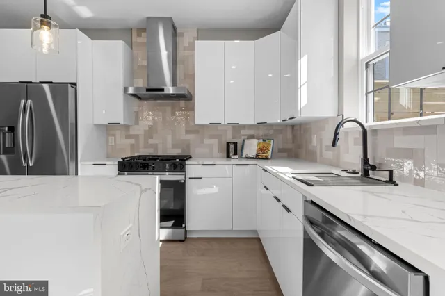 a bathroom sink with a potted plant
