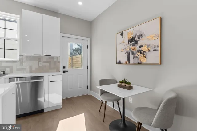 a bathroom with a toilet a sink and a mirror