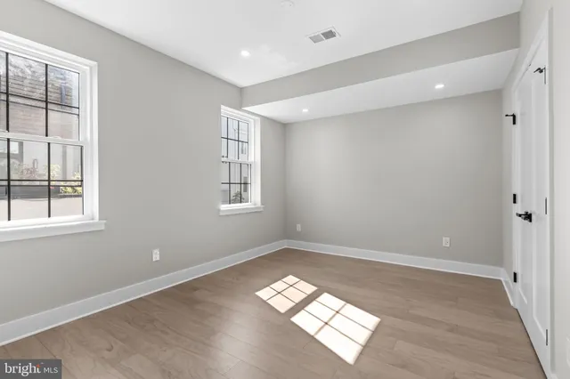 a view of a storage and utility room with washer and dryer