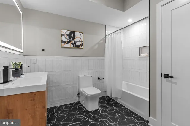 a bedroom with a bed and night stand