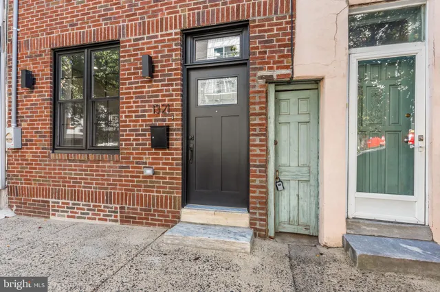 a living room with furniture and a stairs