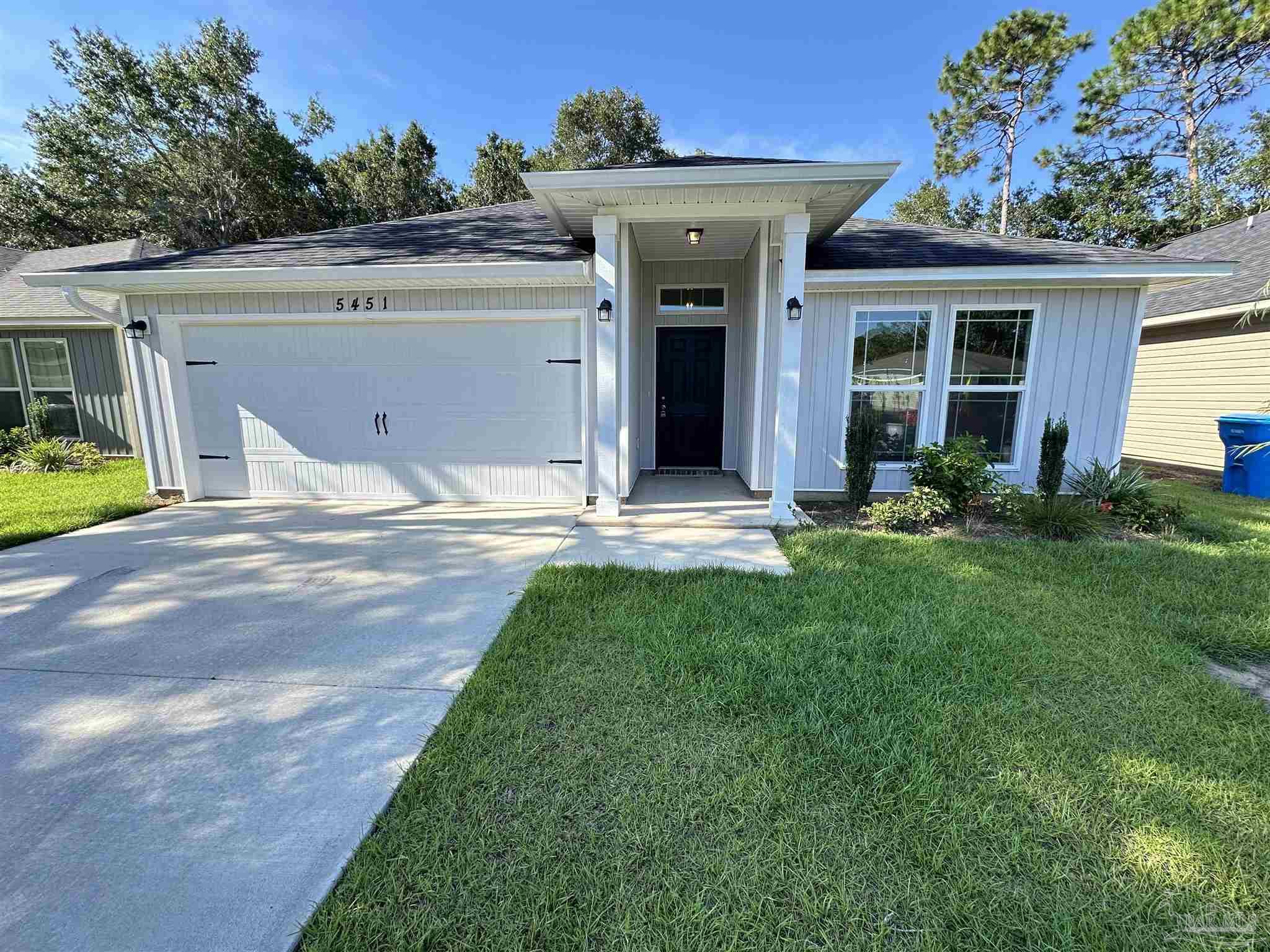5451 Cherub Circle Milton, FL 32583 - Photo 1 of 13 a view of a house with backyard and sitting area
