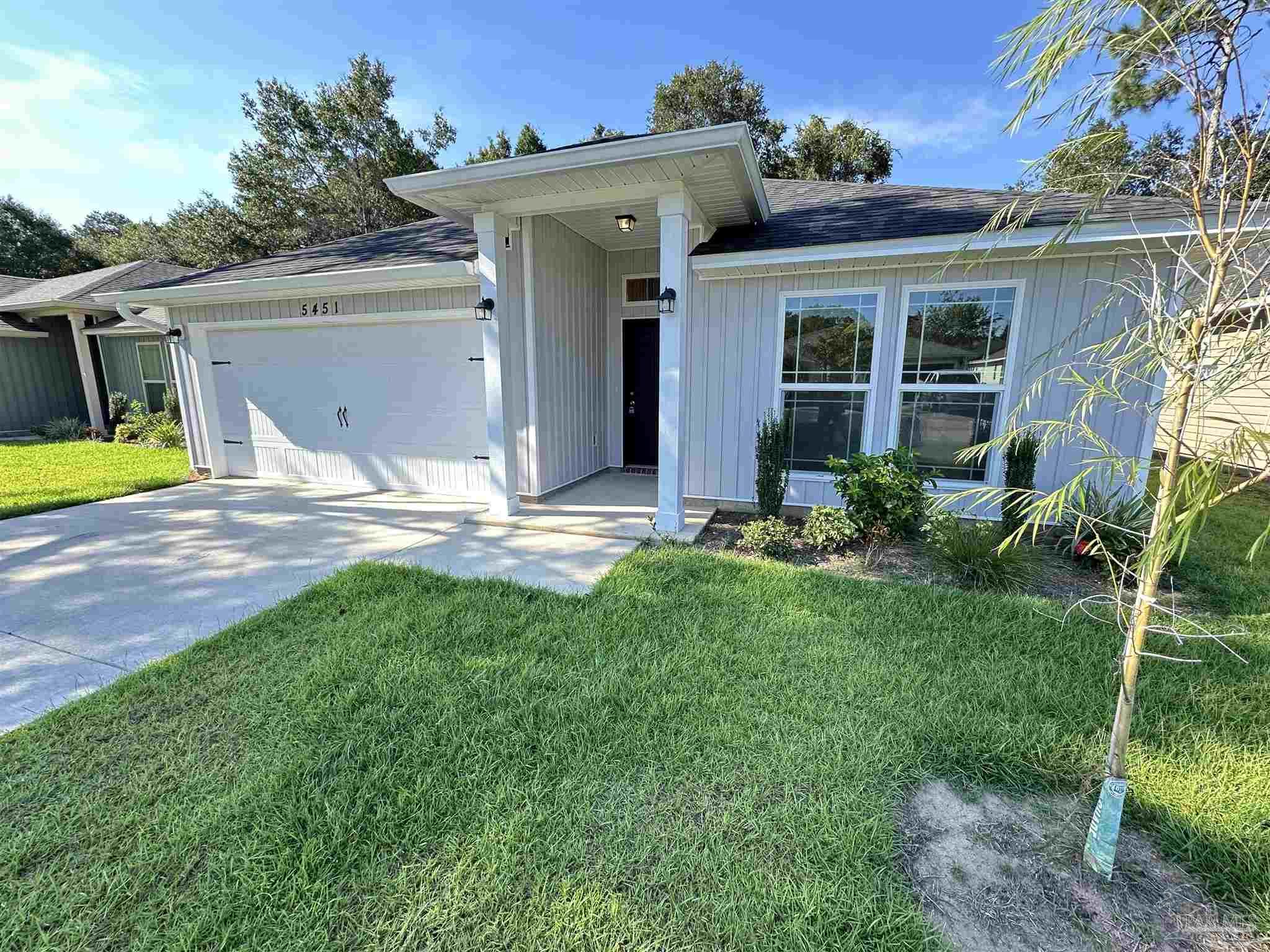 5451 Cherub Circle Milton, FL 32583 - Photo 2 of 13 a view of a house with backyard and porch