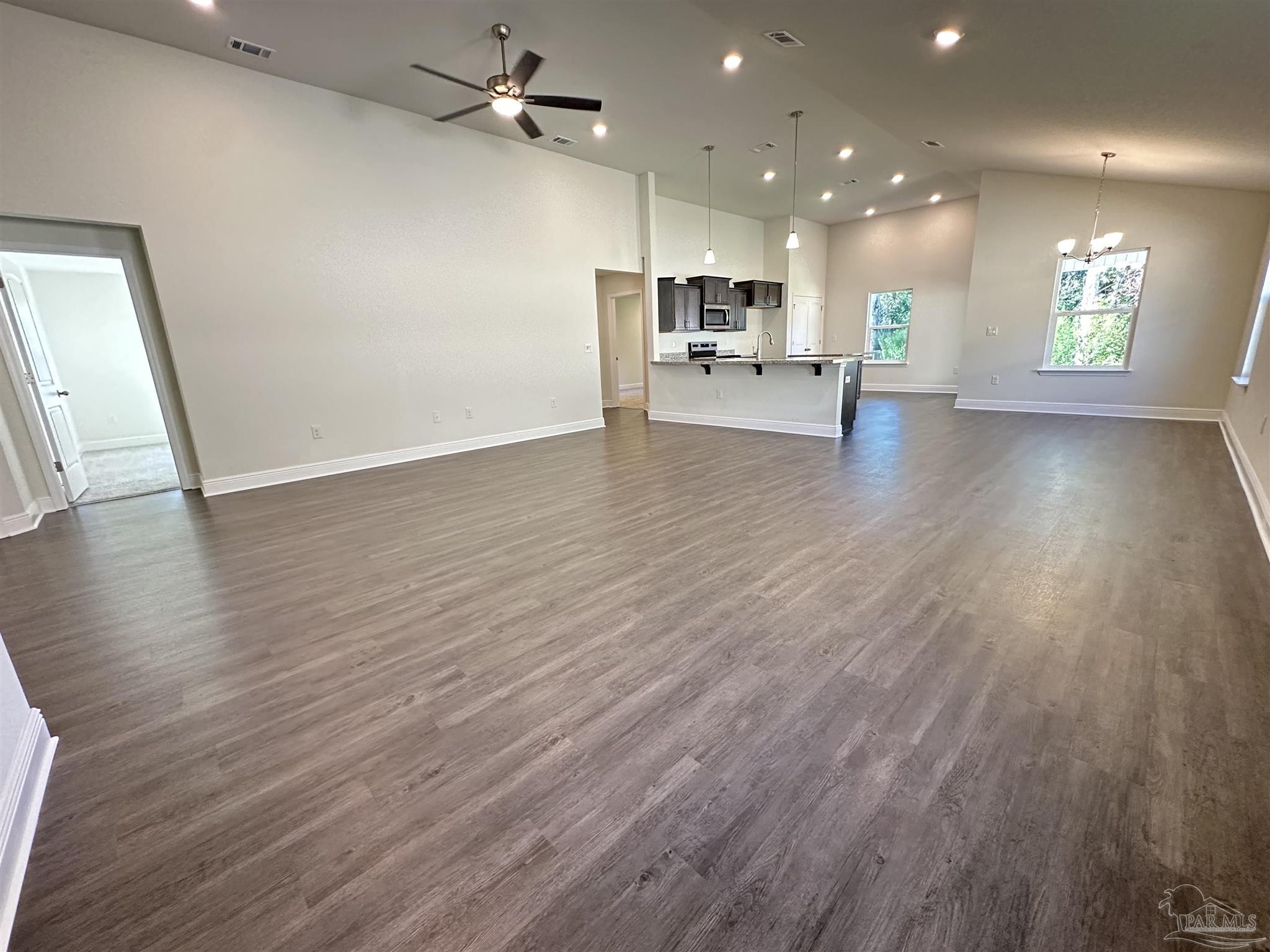 5451 Cherub Circle Milton, FL 32583 - Photo 4 of 13 a view of a kitchen with a sink and a microwave
