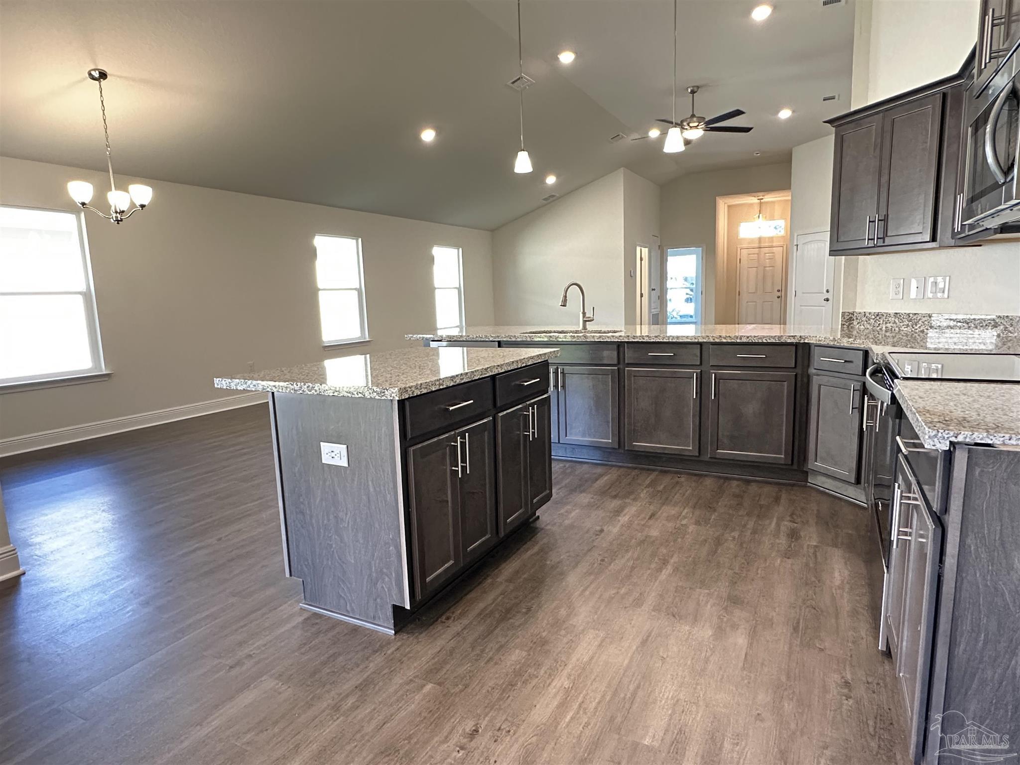 5451 Cherub Circle Milton, FL 32583 - Photo 8 of 13 a kitchen with lots of counter top space and appliances
