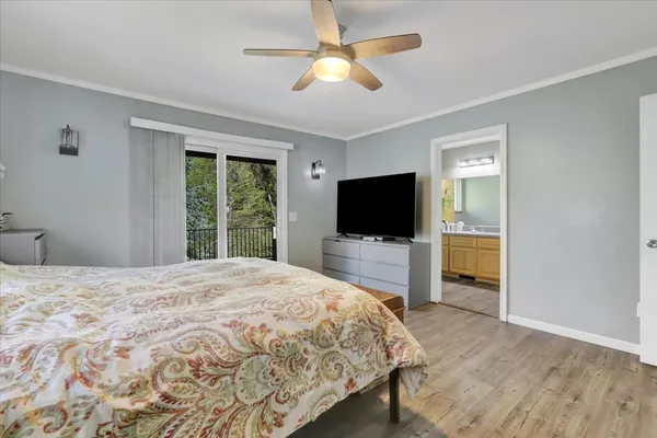 a bedroom that has a bed and a desk in it