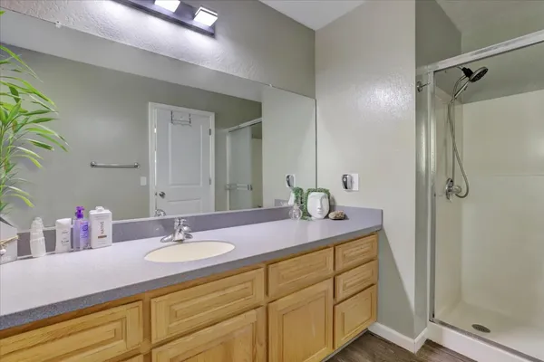 a bedroom with a bed and flat screen tv