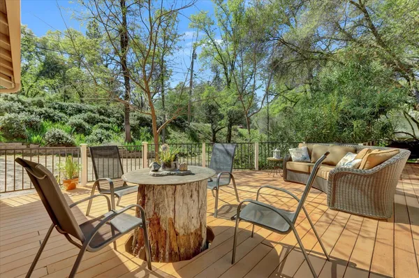 a view of a chairs and table in patio