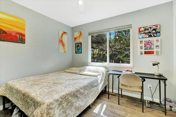a spacious bathroom with a double vanity sink a large mirror and a bathtub