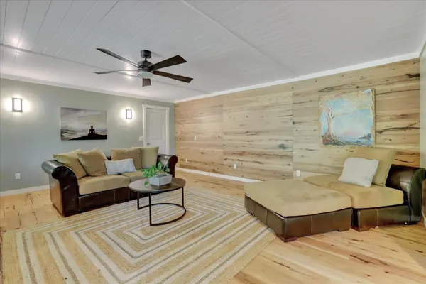 a kitchen with kitchen island granite countertop a stove and a sink
