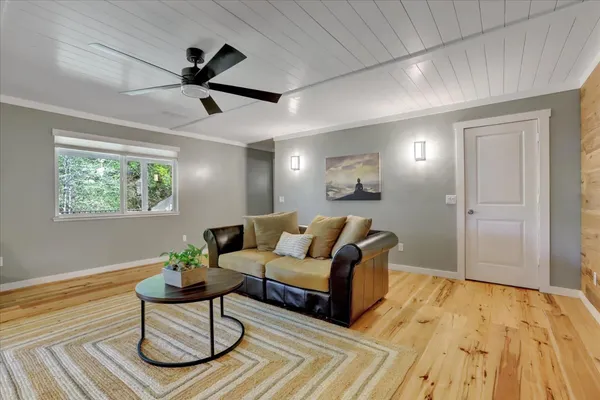 a kitchen with granite countertop a sink stainless steel appliances and cabinets