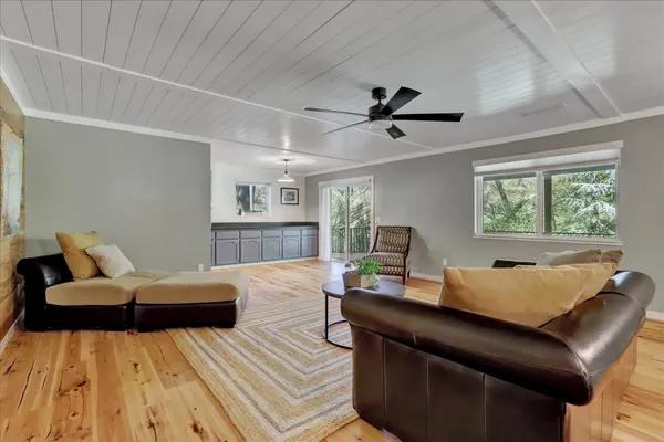 a kitchen with kitchen island granite countertop a stove and a sink
