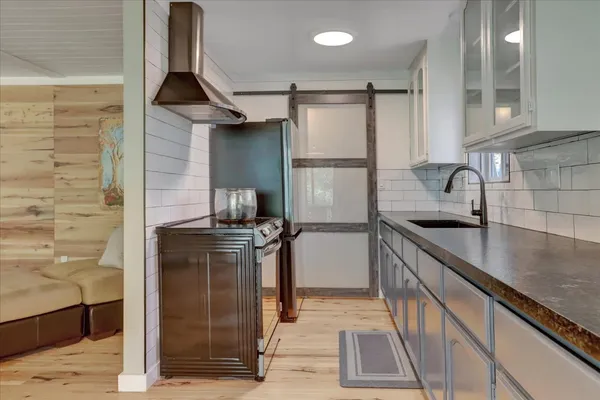 a bedroom with a bed and a television