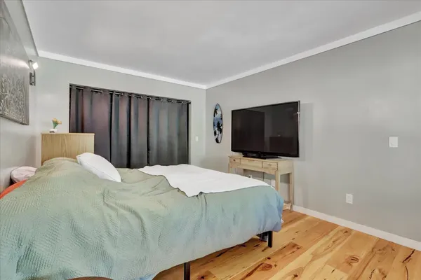 a view of a balcony with wooden floor