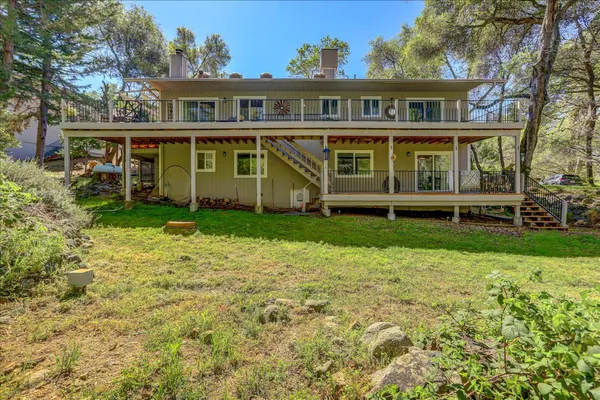 an aerial view of a house with a lake view