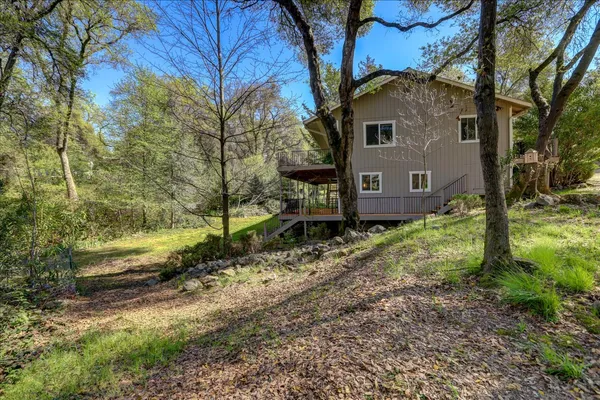 a view of a swimming pool with an outdoor space and seating area