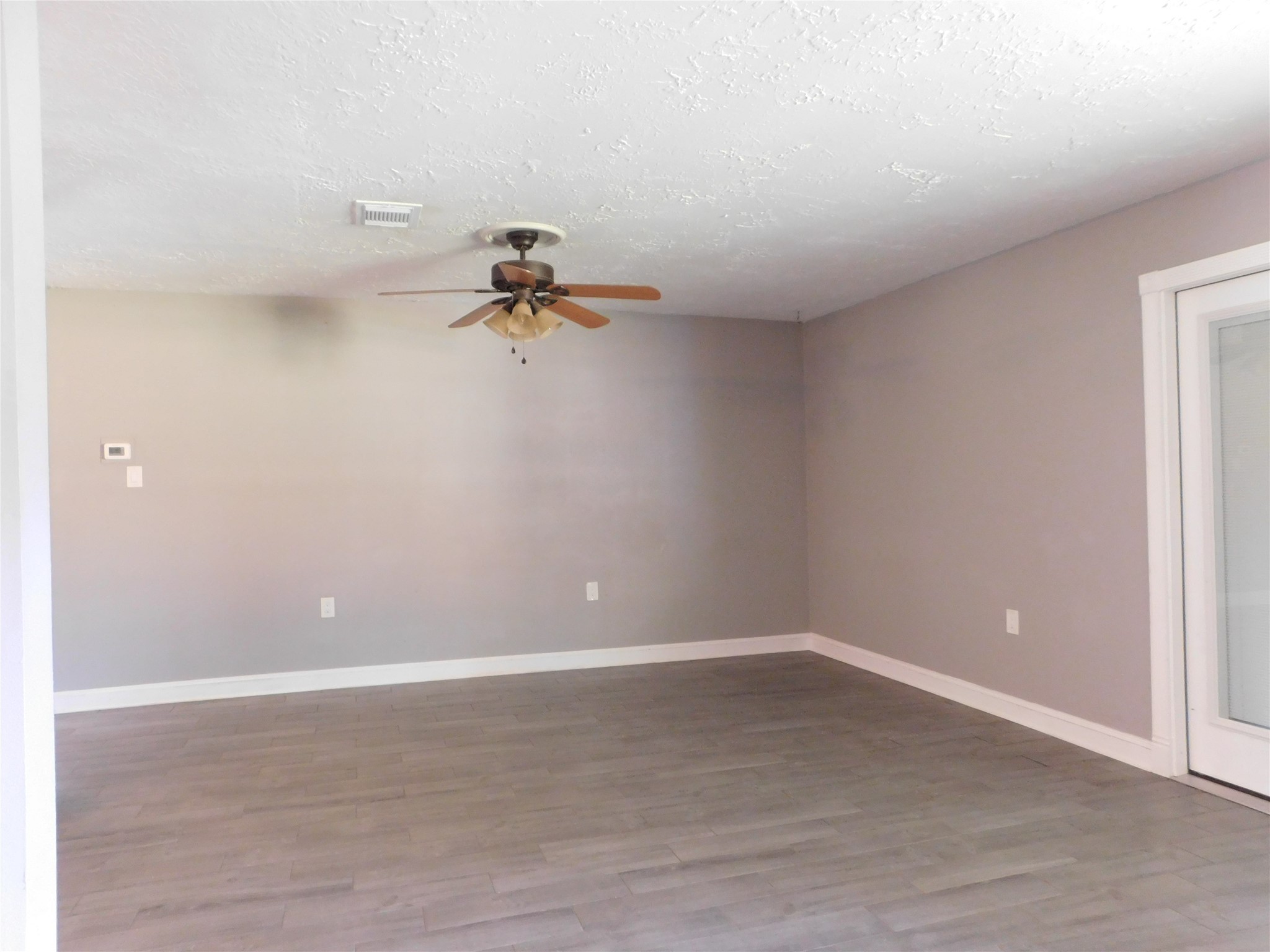 5003 Apple Springs Drive Pearland, TX 77584 - Photo 12 of 29 a view of a room with wooden floor