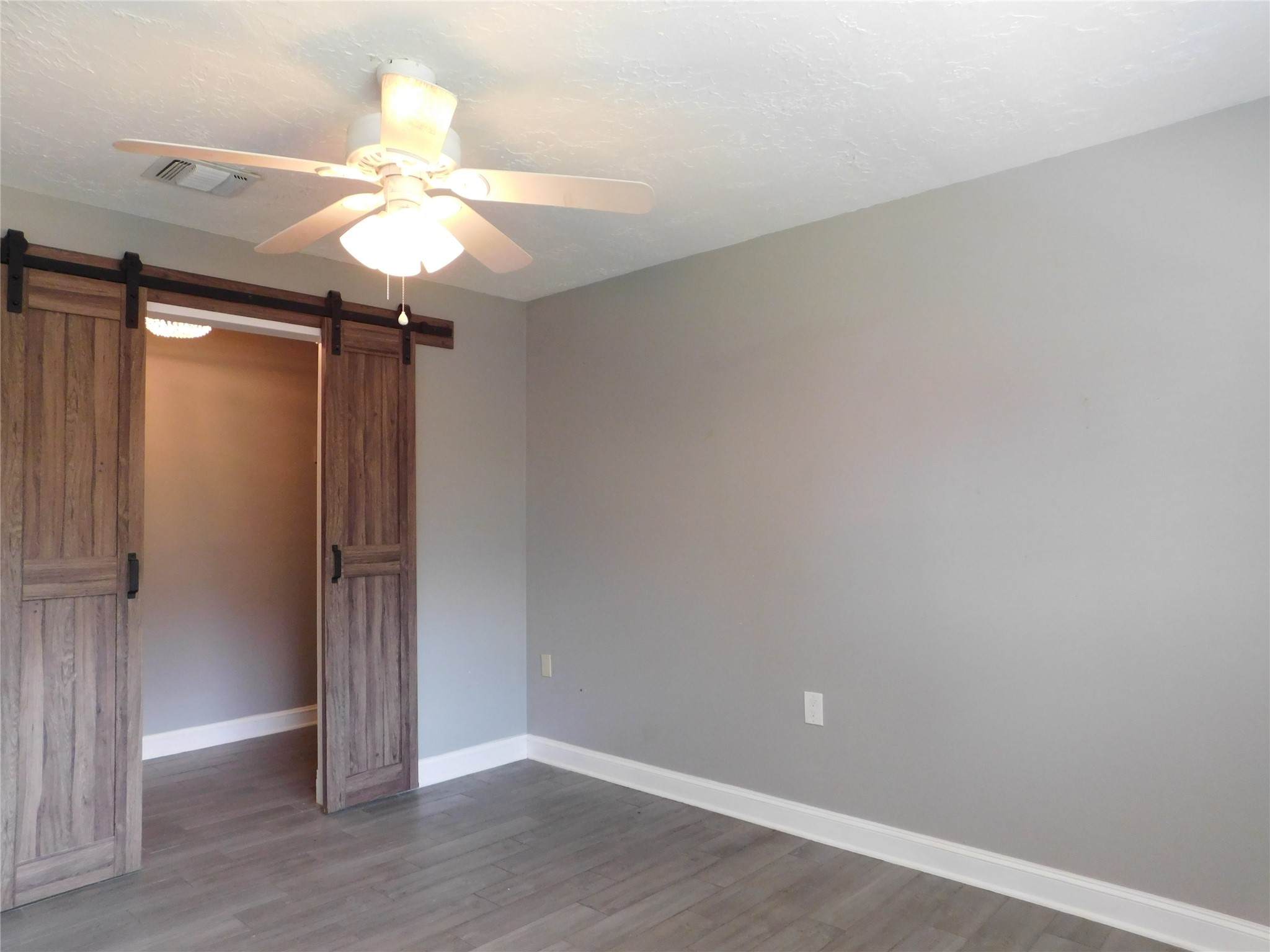 5003 Apple Springs Drive Pearland, TX 77584 - Photo 15 of 29 wooden floor in an empty room