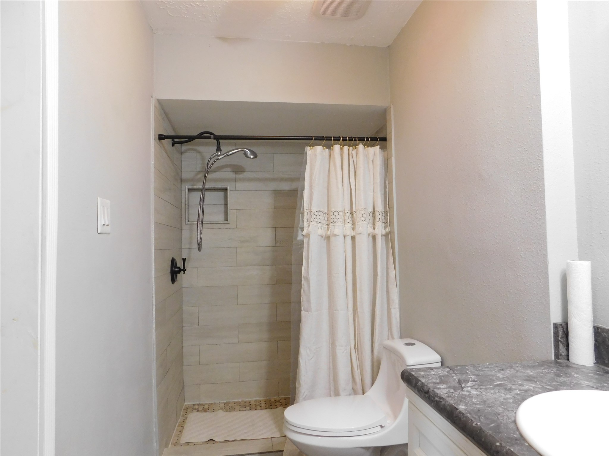 5003 Apple Springs Drive Pearland, TX 77584 - Photo 16 of 29 a bathroom with a granite countertop sink toilet and shower
