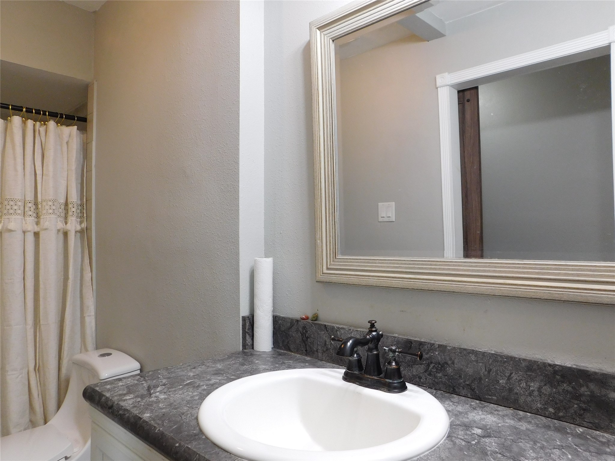 5003 Apple Springs Drive Pearland, TX 77584 - Photo 17 of 29 a bathroom with a sink and a mirror