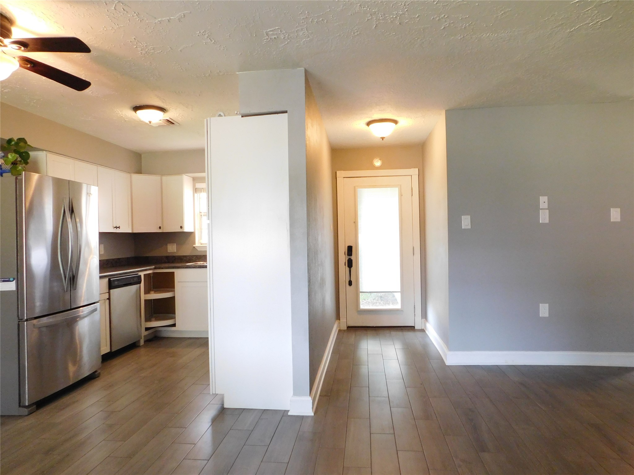 5003 Apple Springs Drive Pearland, TX 77584 - Photo 19 of 29 a view of kitchen with wooden floor electronic appliances and window