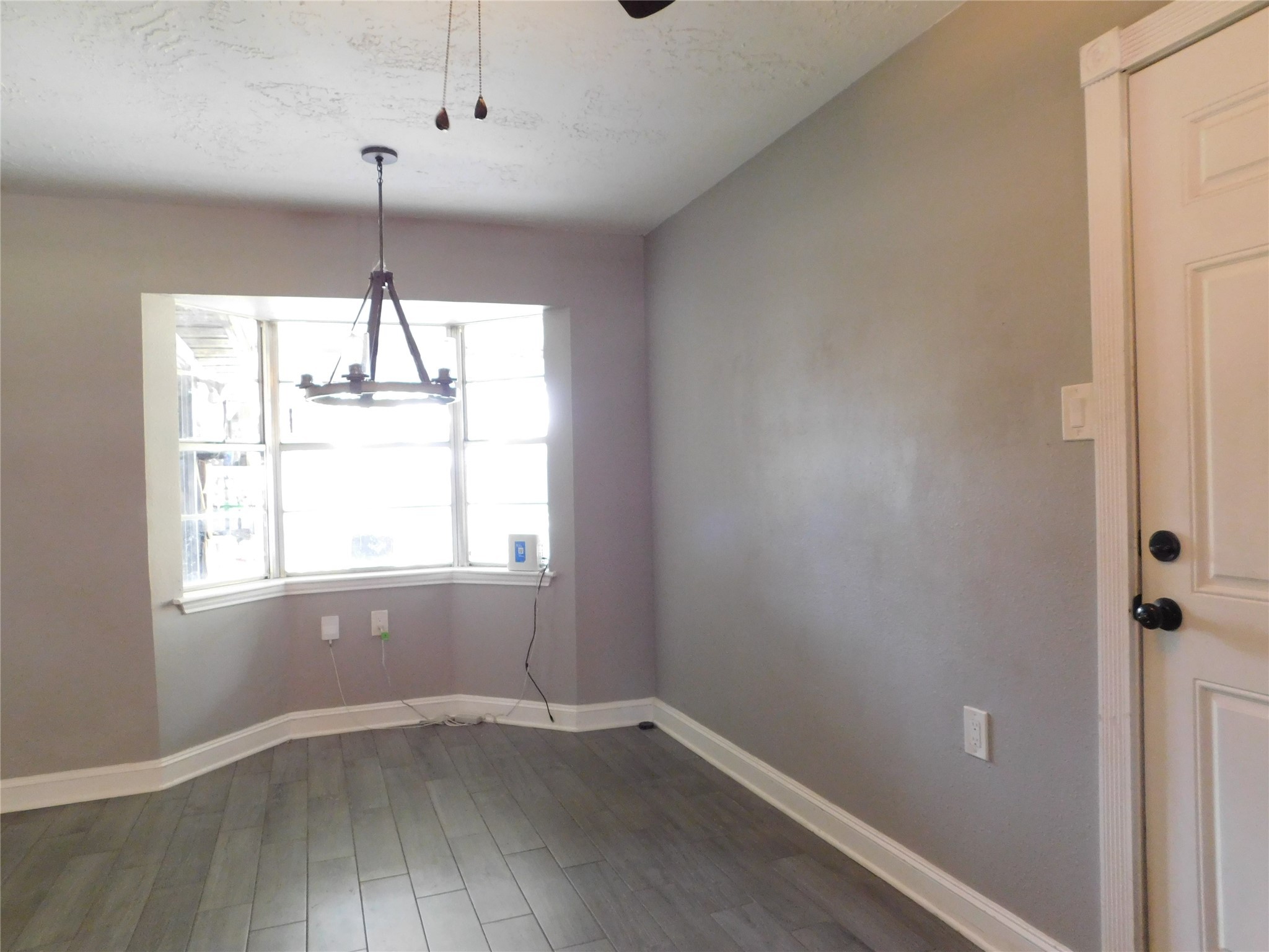 5003 Apple Springs Drive Pearland, TX 77584 - Photo 25 of 29 an empty room with a window and wooden floor