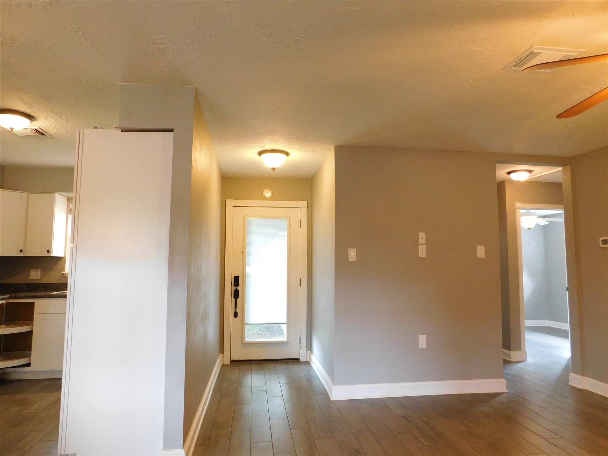 5003 Apple Springs Drive Pearland, TX 77584 - Photo 6 of 29 a view of a hallway with wooden floor
