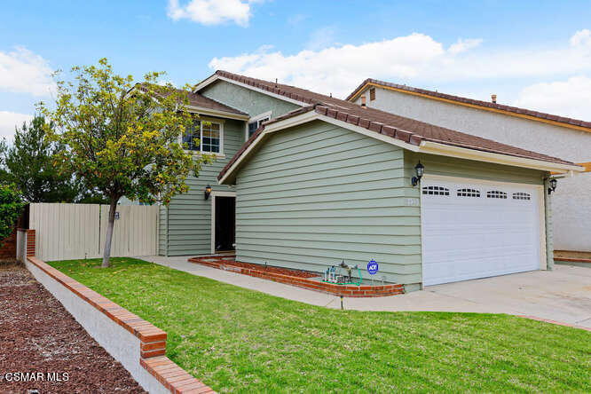 3345 Manorgate Place Simi Valley, CA 93065 - Photo 1 of 27 a view of a house with a yard and garage