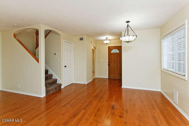 3345 Manorgate Place Simi Valley, CA 93065 - Photo 20 of 27 a view of a livingroom with wooden floor and stairs