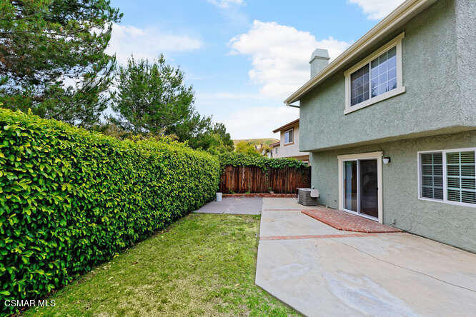 3345 Manorgate Place Simi Valley, CA 93065 - Photo 25 of 27 a view of a house with backyard and garden
