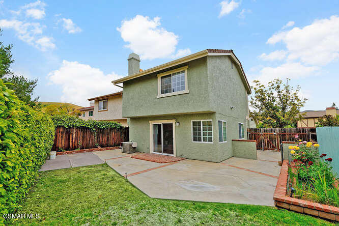 3345 Manorgate Place Simi Valley, CA 93065 - Photo 26 of 27 a front view of a house with a yard