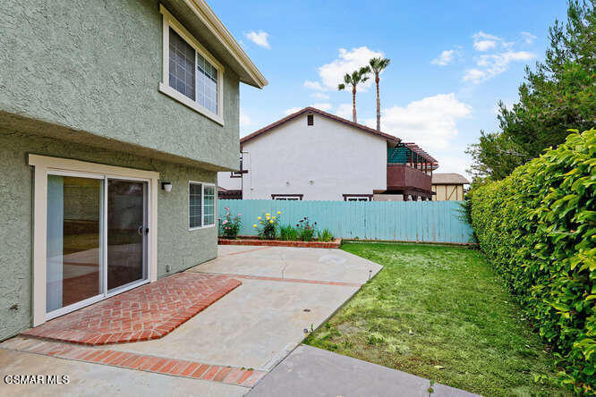 3345 Manorgate Place Simi Valley, CA 93065 - Photo 27 of 27 a view of a house with a yard and potted plants