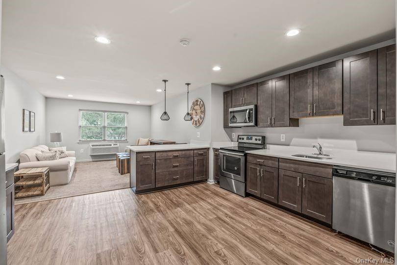 a large kitchen with stainless steel appliances lots of counter top space