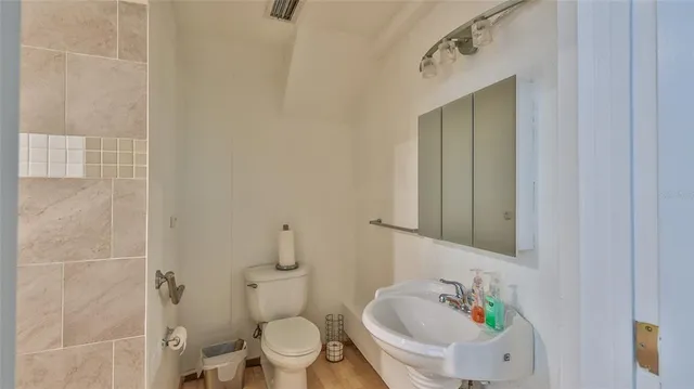 a bathroom with a sink and toilet