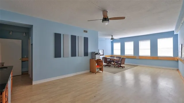 a view of a livingroom with furniture and a window