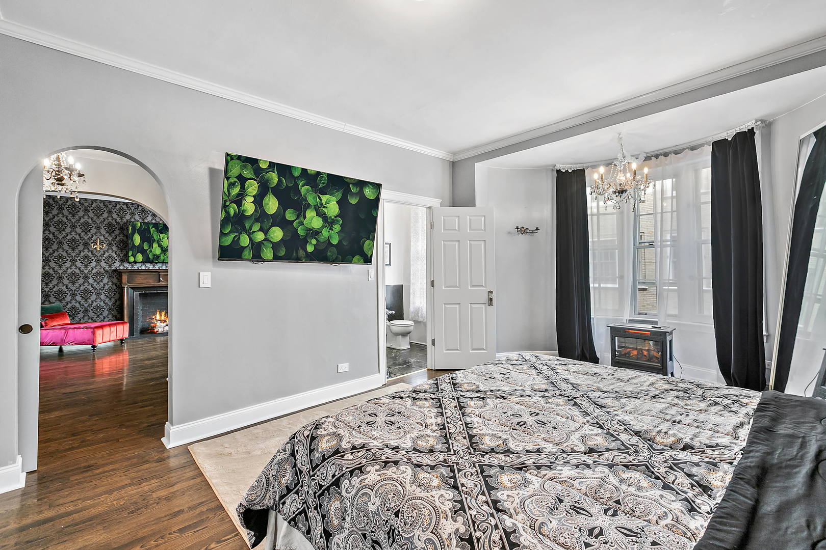 60 East Scott Street, Unit 703 Chicago, IL 60610 - Photo 13 of 27 a bedroom with a bed mirror and a window