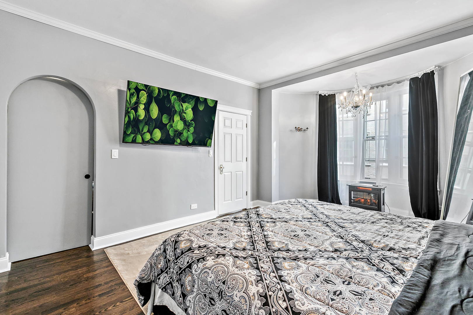 60 East Scott Street, Unit 703 Chicago, IL 60610 - Photo 14 of 27 a bedroom with a bed and a flat screen tv
