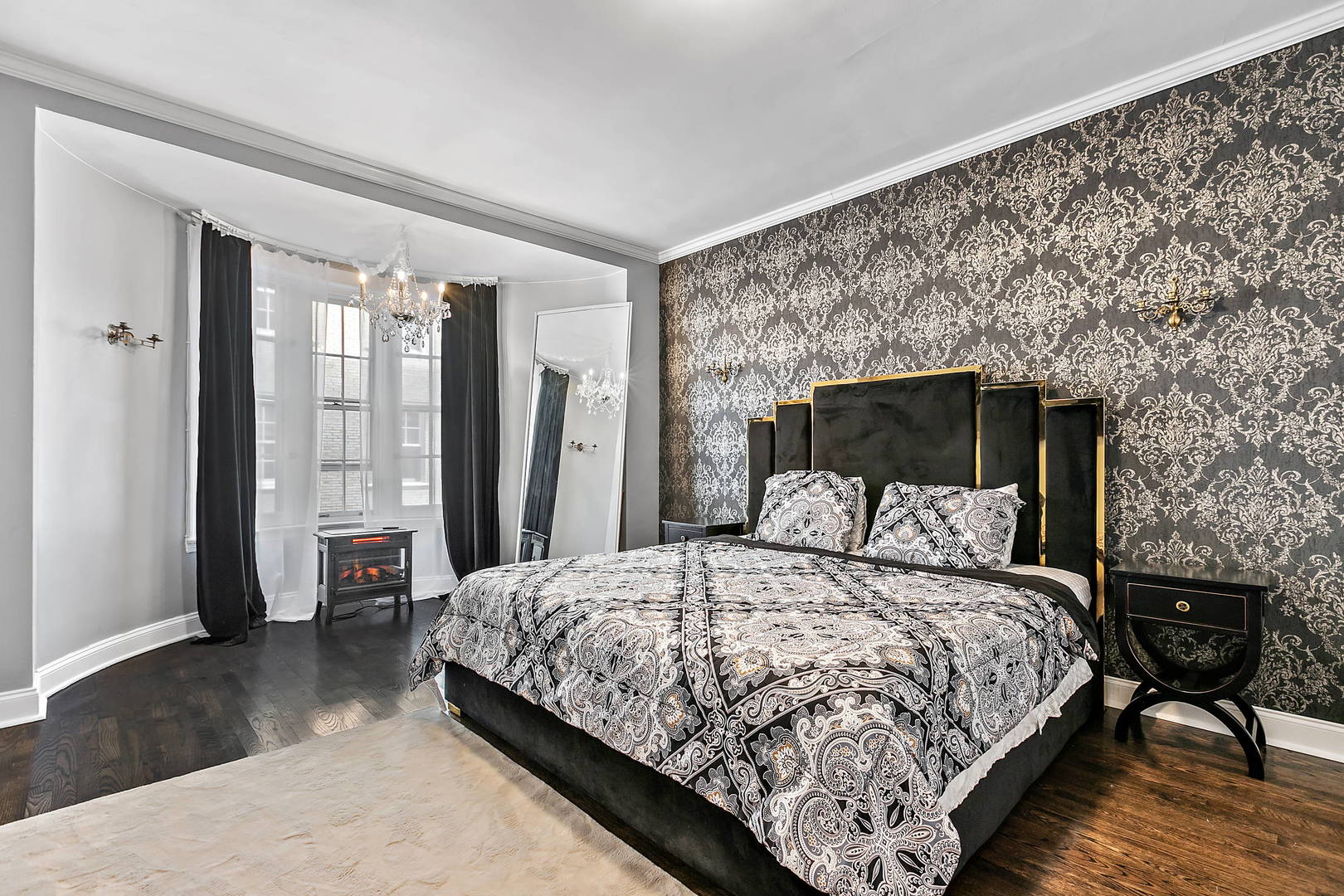60 East Scott Street, Unit 703 Chicago, IL 60610 - Photo 16 of 27 a bedroom with a large bed and a night stand